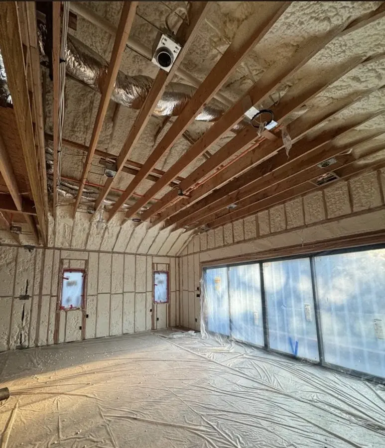 Interior walls and ceiling insulated with spray foam during new construction in Westerly